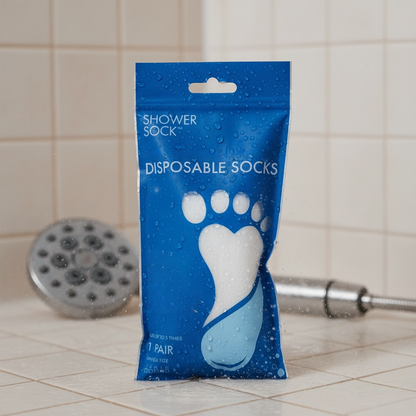 Shower Socks in blue packaging on a shower floor
